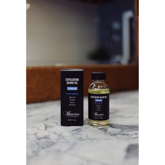 Baxter of California Exfoliating Beard Oil. 1 oz oil that hydrates and conditions while exfoliating skin. Salicylic acid works against dead skin and ingrown hairs, with olive fruit oil, sunflower seed oil, and shea butter for added softness.