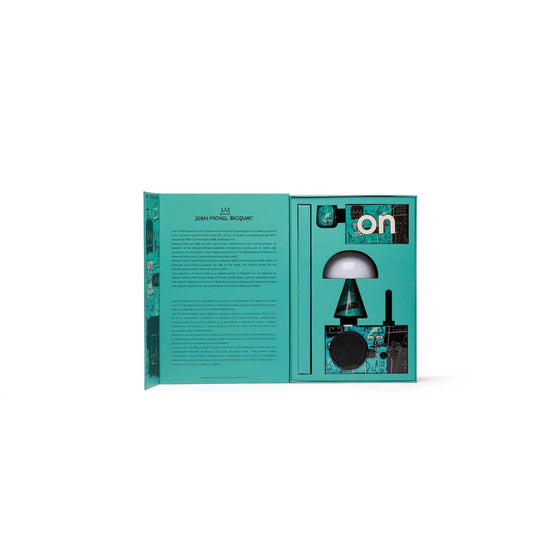Inside view of the Equals Pi gift set showing Lexon tech products fitted inside Basquiat-themed packaging with expressive symbols, color blocking, and clean presentation.
