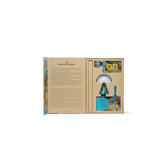 Open interior view of the Untitled Skull gift set showing each Lexon item secured in customized packaging, featuring skull iconography and expressive color treatment.