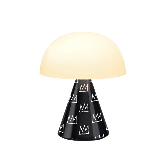 Lexon MINA M lamp in matte black featuring Jean-Michel Basquiat’s crown. A visual emblem of power, creativity, and rebellion reimagined as ambient light.