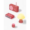 All items from the heart pink Lexon gift set laid out flat, displaying Keith Haring-themed tech accessories and packaging together.