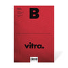 Magazine B - Issue 33 Vitra. The cover features the Vitra logo prominently displayed against a textured red background, reflecting the brand’s rich history in design and innovation.