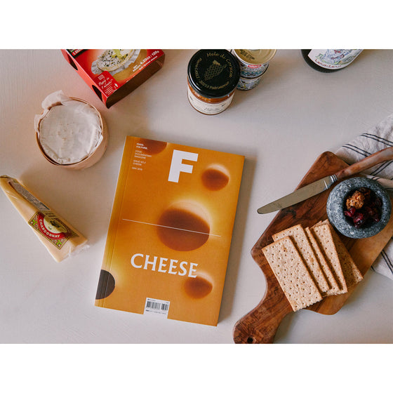 Magazine F - Issue 02 Cheese
The magazine rests beside a charcuterie board, complementing the selection of cheeses and cured meats, emphasizing the magazine's focus on cheese as both a delicacy and a culinary staple.