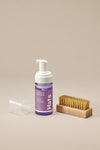 Jason Markk Hat Care Kit. The kit's contents displayed: 4oz Ready-To-Use Hat Cleaner and Premium Cleaning Brush, highlighting their design and features.