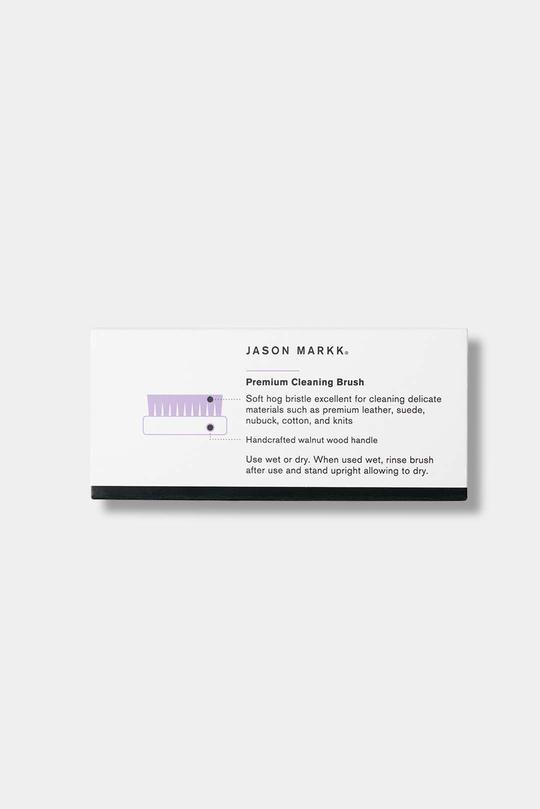 Jason Markk Premium Cleaning Brush. Back of the packaging with detailed product information and usage instructions for cleaning delicate materials with care.