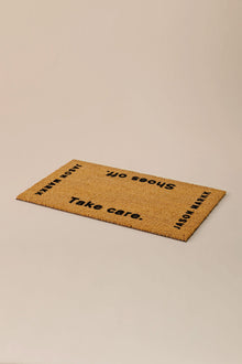  Jason Markk Shoes Off Welcome Mat. 18" x 30" mat made from natural coconut fiber with heavy-duty vinyl backing, designed to keep your home clean by removing dirt and microorganisms from shoes.